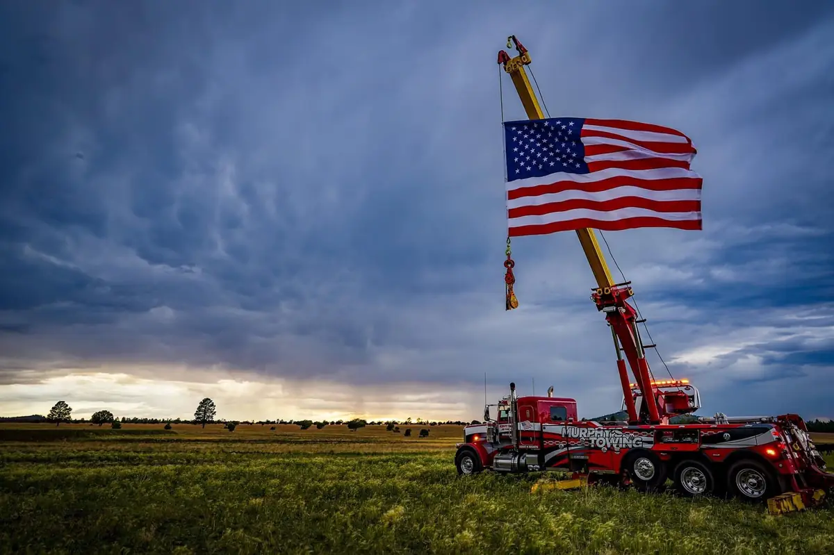 Murphy's Towing heavy wrecker with American flag